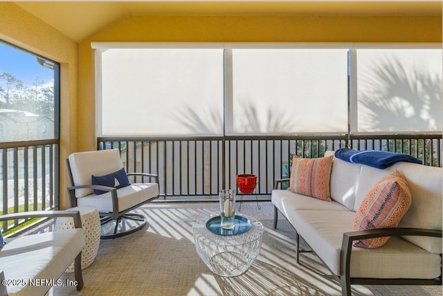 sunroom / solarium with vaulted ceiling