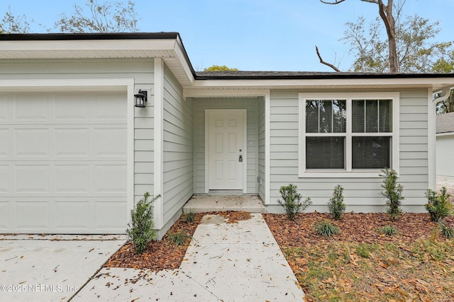 entrance to property featuring a garage