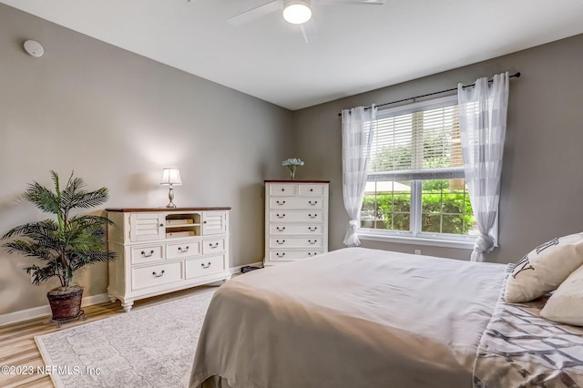 bedroom featuring ceiling fan and light hardwood / wood-style flooring