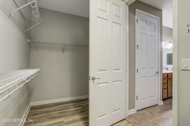 walk in closet with sink