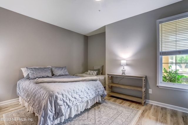 bedroom featuring ceiling fan and light hardwood / wood-style flooring