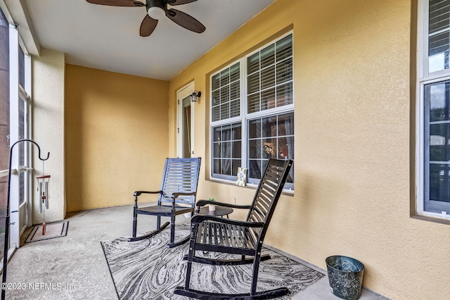 exterior space with ceiling fan