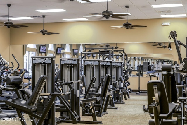 workout area featuring a drop ceiling