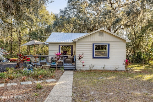 bungalow-style home featuring a wooden deck