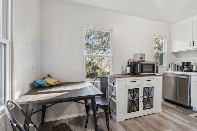 dining area featuring light wood-type flooring