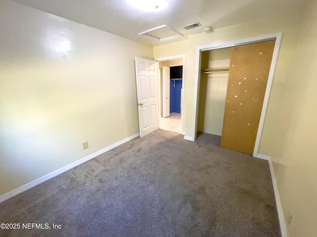 unfurnished bedroom featuring a closet and light carpet