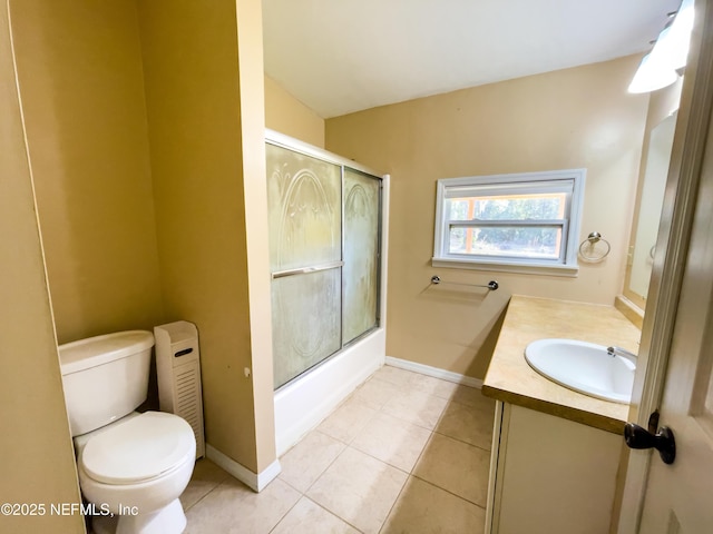 full bathroom with toilet, vanity, tile patterned flooring, and enclosed tub / shower combo