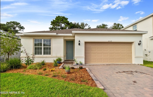 single story home featuring a front yard and a garage