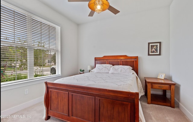 bedroom with light colored carpet and ceiling fan