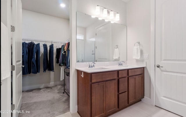 bathroom featuring tile patterned flooring and vanity