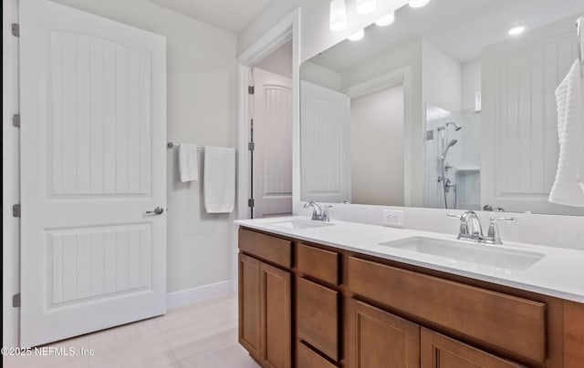 bathroom with vanity, walk in shower, and tile patterned floors