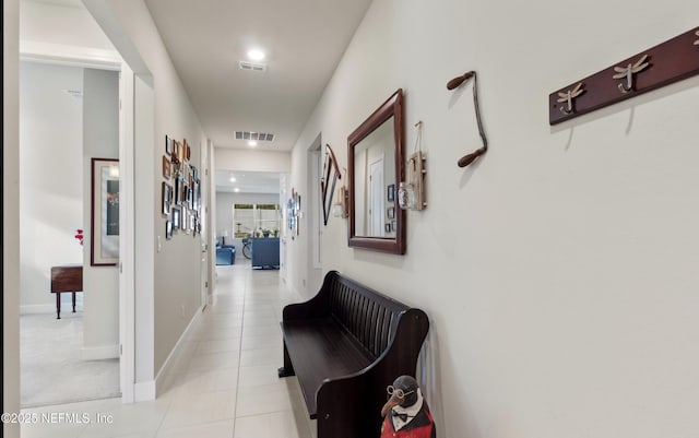 corridor with light tile patterned floors