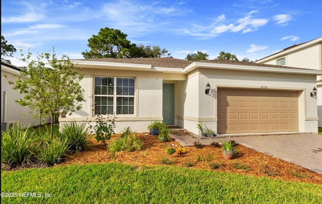 ranch-style house with a front yard and a garage