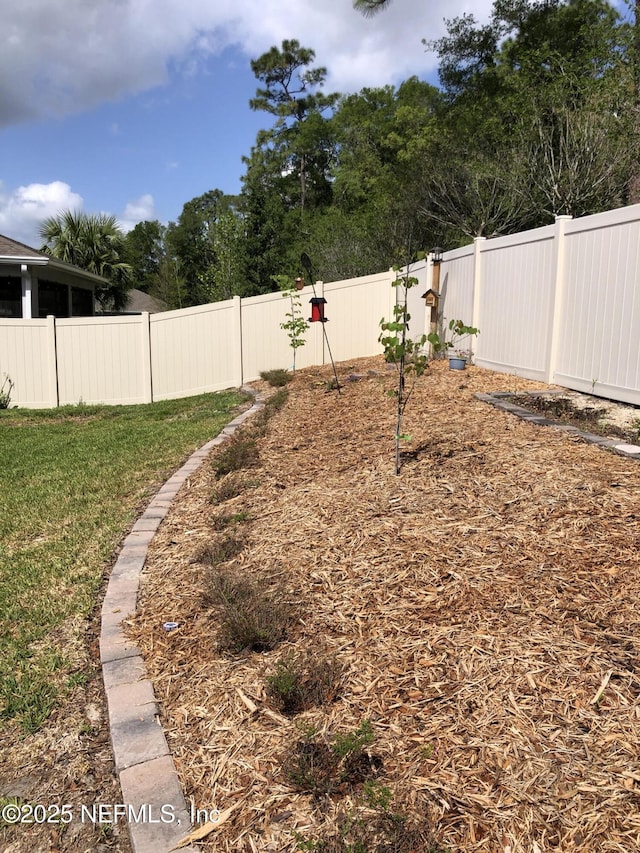 view of yard with a fenced backyard