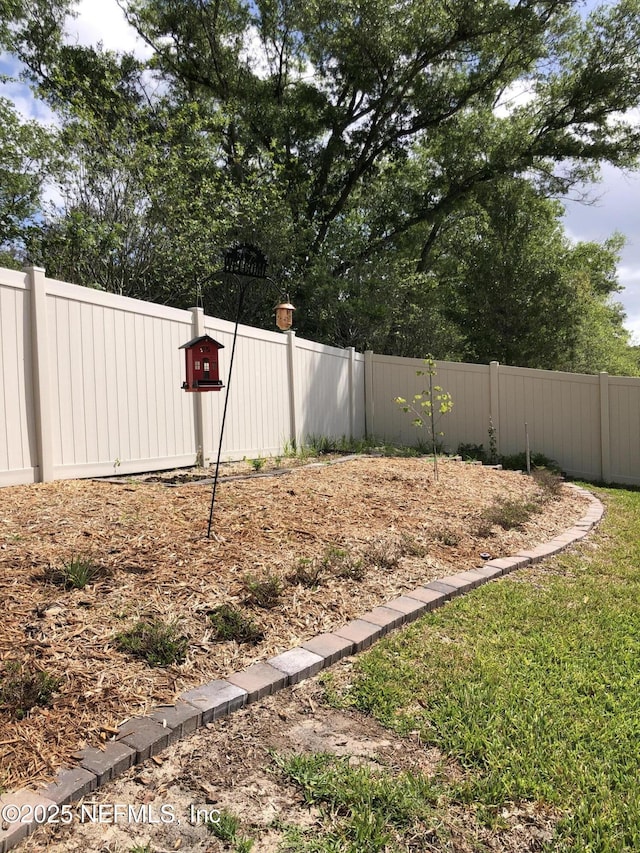 view of yard with fence