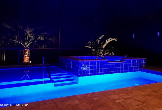 view of pool at night