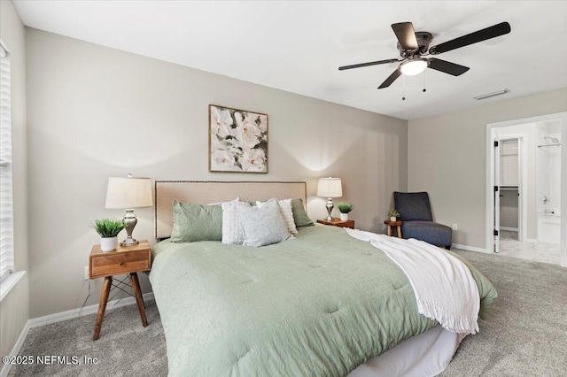 bedroom with ceiling fan, a spacious closet, a closet, and carpet flooring