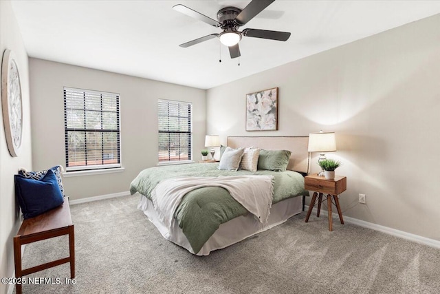 bedroom featuring light carpet and ceiling fan