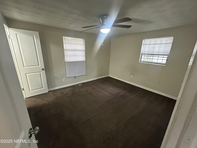 unfurnished room with ceiling fan