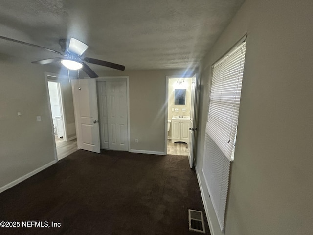 interior space featuring ceiling fan