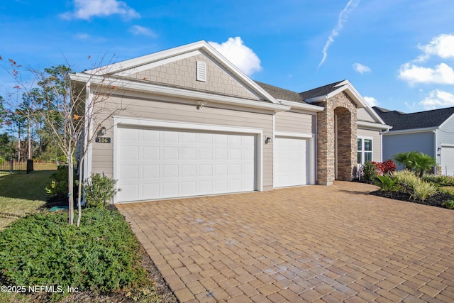 ranch-style house featuring a garage