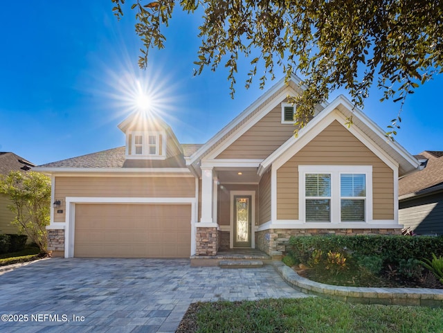 craftsman house with a garage