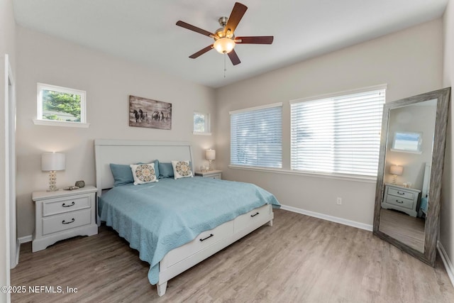 bedroom featuring ceiling fan and light hardwood / wood-style flooring