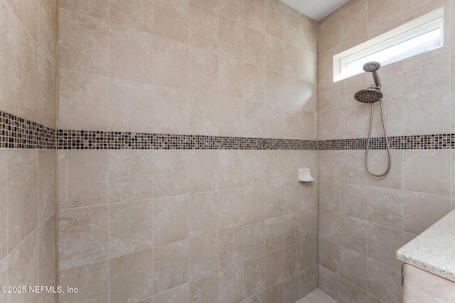 bathroom with tiled shower