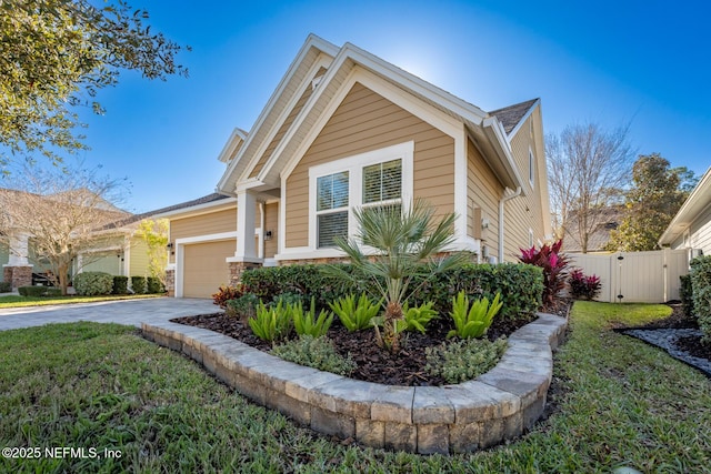 view of front of home with a front yard and a garage