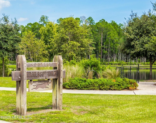 surrounding community featuring a lawn