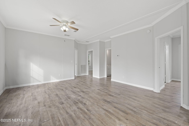 empty room with ceiling fan, light wood-type flooring, and crown molding