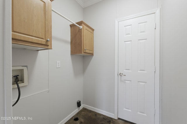 laundry room featuring cabinets, ornamental molding, and washer hookup