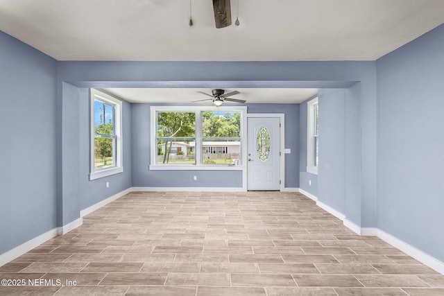 interior space featuring ceiling fan and light wood-type flooring