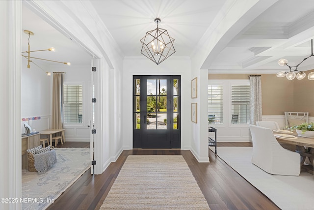 entryway with beam ceiling, dark hardwood / wood-style floors, coffered ceiling, and ornamental molding