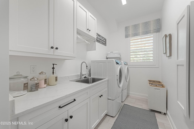 264 N Roscoe Blvd, Palm Valley, FL 32082 - laundry room featuring sink, light tile patterned floors, radiator, cabinets, and washing machine and clothes dryer