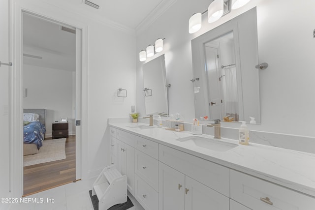 264 N Roscoe Blvd, Palm Valley, FL 32082 - bathroom featuring crown molding, tile patterned floors, and vanity