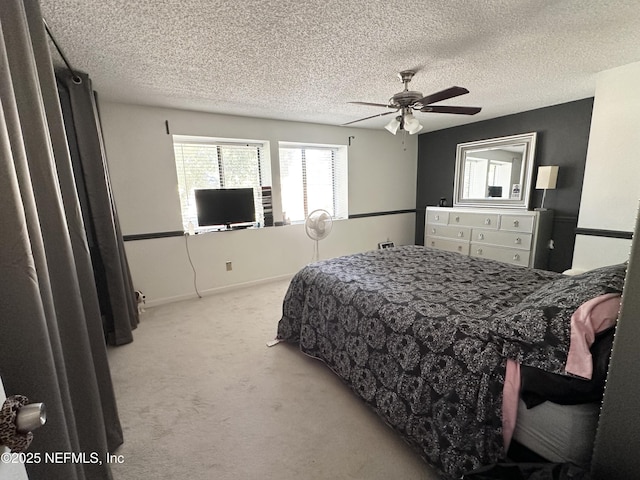 7020 Prestwick Cir N, Jacksonville, FL 32244 - carpeted bedroom with baseboards, a textured ceiling, and a ceiling fan