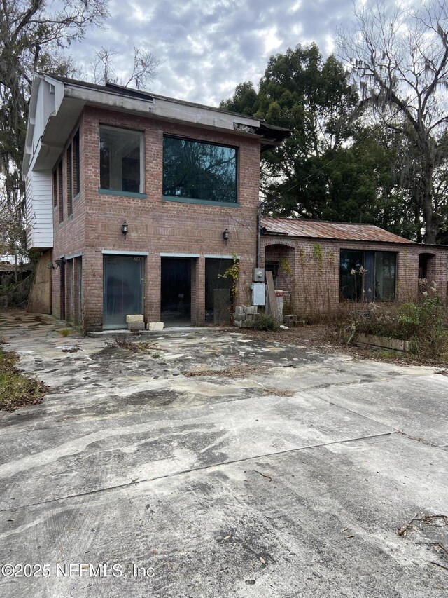 746 N Walnut St, Starke, FL 32091 - exterior space with a garage