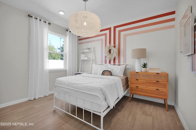 bedroom with wood-type flooring