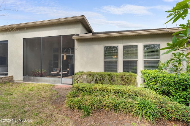 rear view of house with a sunroom