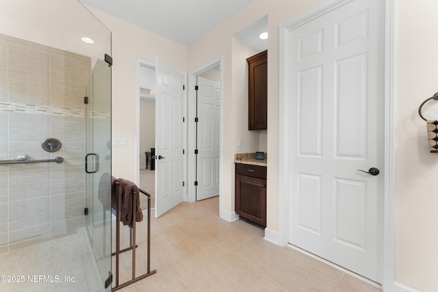 bathroom featuring vanity and walk in shower