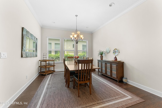 dining area featuring ornamental molding, a chandelier, and dark hardwood / wood-style floors