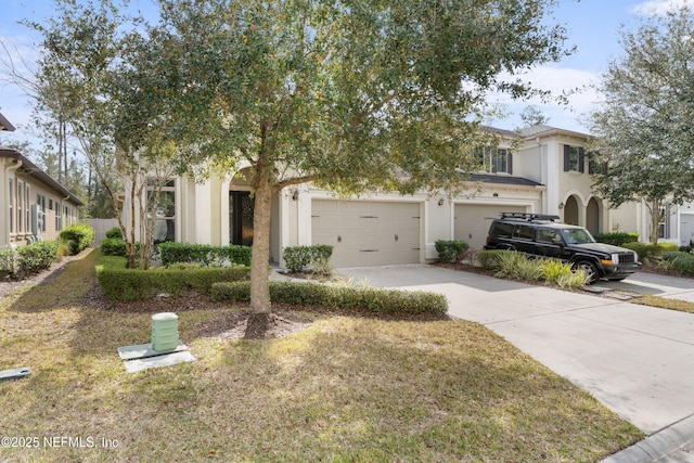 view of front of house featuring a front lawn and a garage