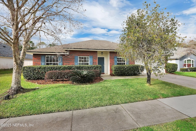 single story home featuring a front lawn