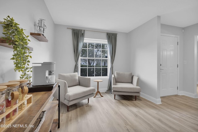 sitting room with light hardwood / wood-style flooring