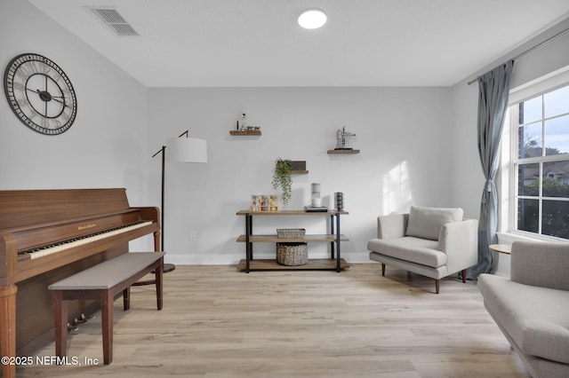 sitting room featuring light hardwood / wood-style flooring