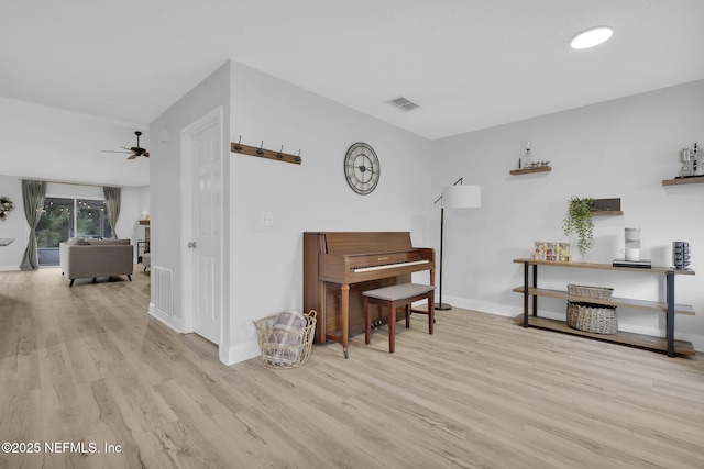 miscellaneous room with ceiling fan and light hardwood / wood-style floors