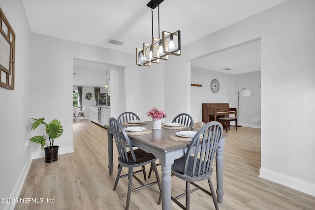 dining area with light hardwood / wood-style flooring