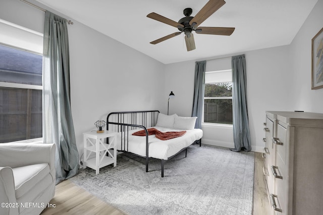 bedroom with ceiling fan and light hardwood / wood-style flooring