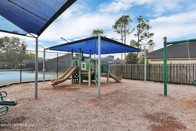 view of jungle gym with tennis court